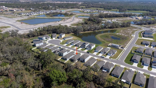 bird's eye view featuring a water view and a residential view