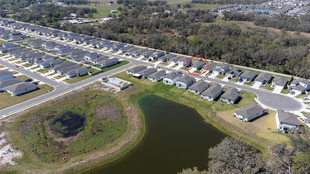 aerial view featuring a water view and a residential view