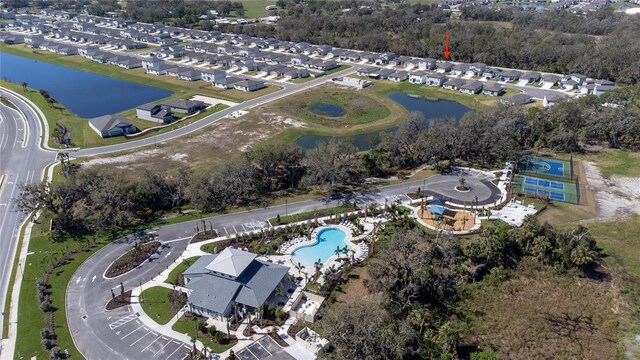 birds eye view of property featuring a water view and a residential view