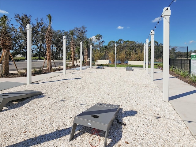 view of property's community with fence