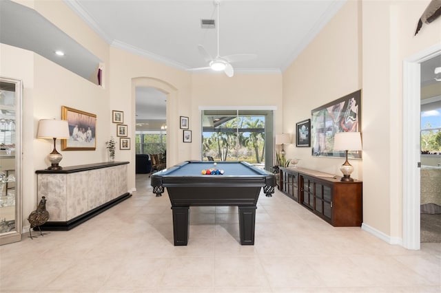 recreation room with baseboards, ceiling fan, pool table, crown molding, and light tile patterned flooring