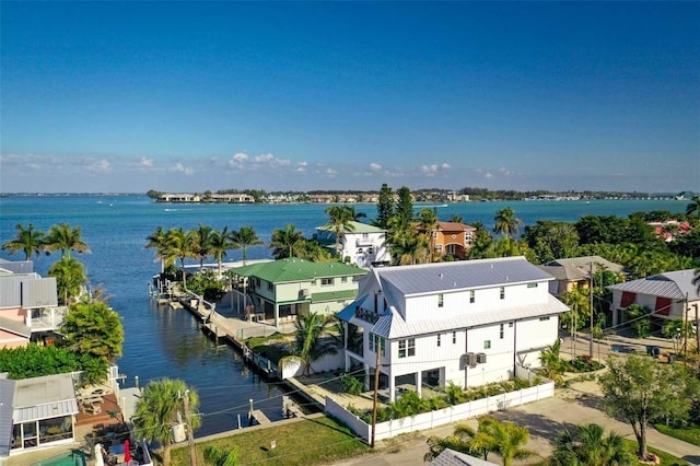 birds eye view of property with a residential view and a water view