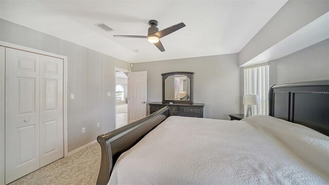 bedroom with carpet, visible vents, ceiling fan, and baseboards