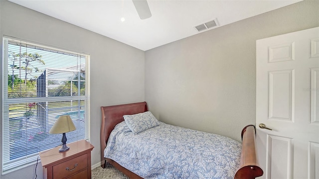 bedroom featuring visible vents and ceiling fan