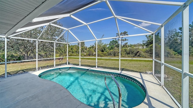 outdoor pool with a lanai, a patio area, and a yard