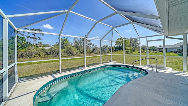 pool featuring a lanai, a patio area, and a lawn