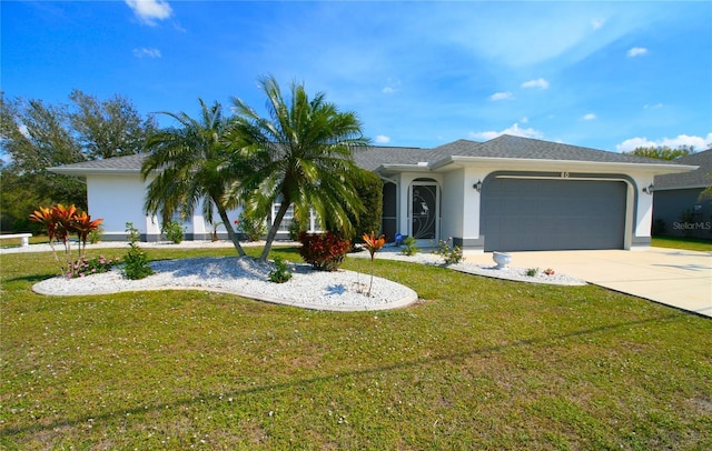 view of front of home featuring driveway, a front yard, an attached garage, and stucco siding