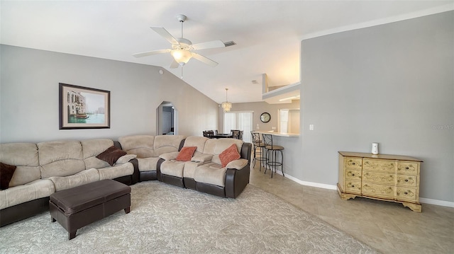 living room with lofted ceiling, ceiling fan, visible vents, and baseboards