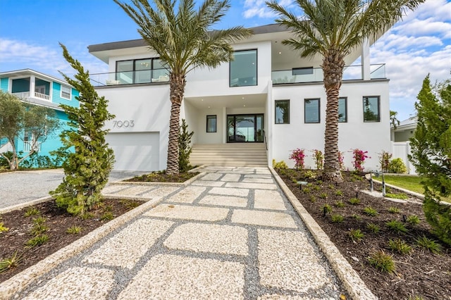 modern home featuring stucco siding and a garage