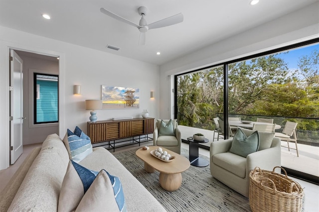 living room featuring recessed lighting, visible vents, and ceiling fan