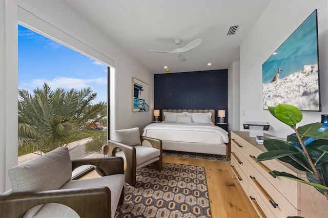 bedroom with a ceiling fan, recessed lighting, visible vents, and light wood-type flooring