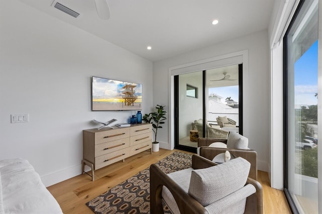 sitting room featuring visible vents, recessed lighting, light wood finished floors, baseboards, and ceiling fan