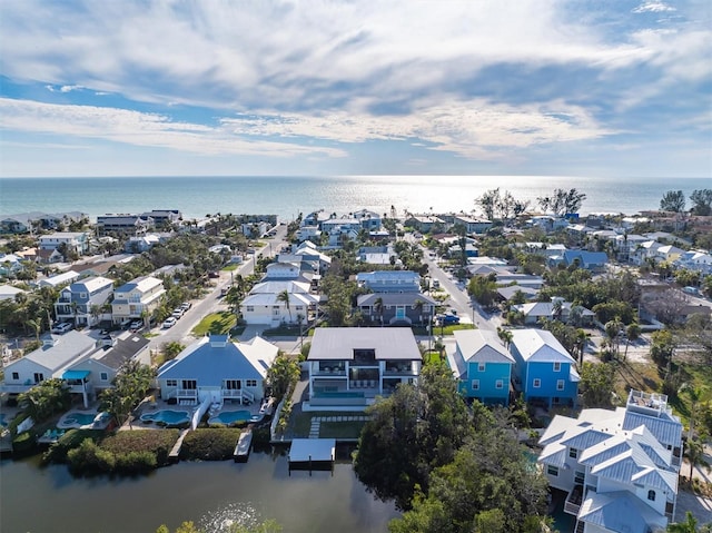 bird's eye view featuring a residential view and a water view