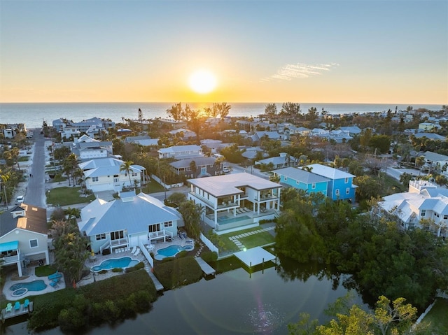 bird's eye view with a residential view and a water view