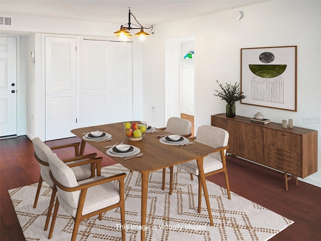 dining area with wood finished floors