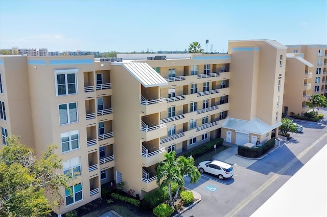 view of property featuring uncovered parking