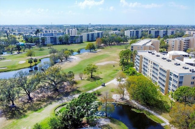 drone / aerial view featuring a water view, a city view, and golf course view