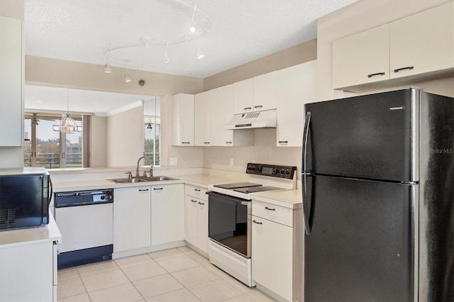 kitchen with light tile patterned floors, under cabinet range hood, white appliances, a sink, and light countertops