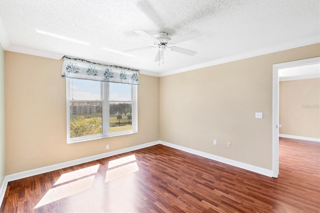 spare room with a textured ceiling, wood finished floors, a ceiling fan, and baseboards