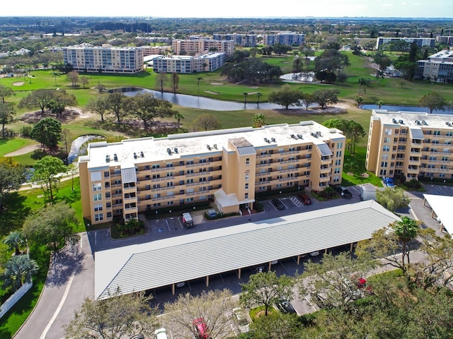 aerial view featuring a view of city, a water view, and golf course view