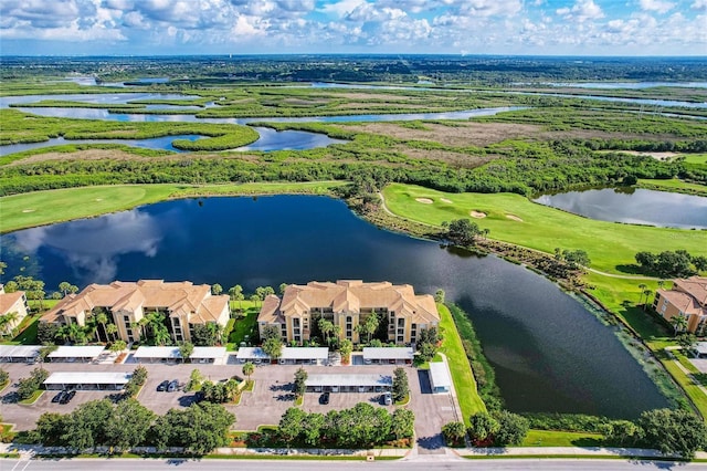 bird's eye view featuring a water view and golf course view