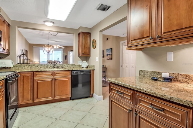 kitchen featuring light stone counters, decorative light fixtures, visible vents, brown cabinetry, and black appliances