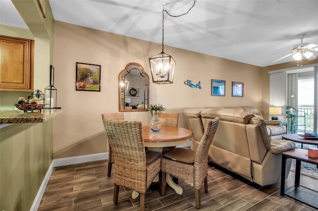 dining room with wood finish floors, a ceiling fan, and baseboards