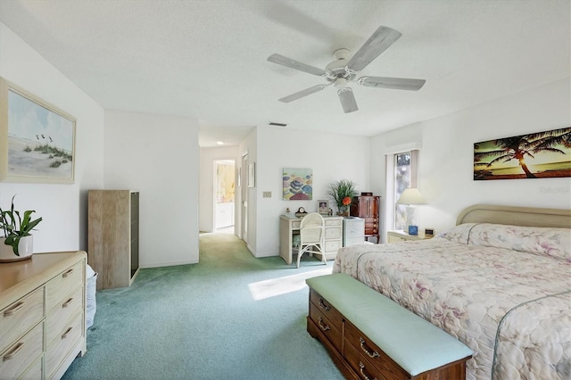 bedroom with a ceiling fan, light colored carpet, and visible vents