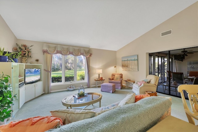 living area featuring lofted ceiling, carpet flooring, visible vents, and baseboards