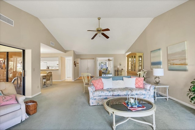 carpeted living room featuring baseboards, high vaulted ceiling, visible vents, and a ceiling fan