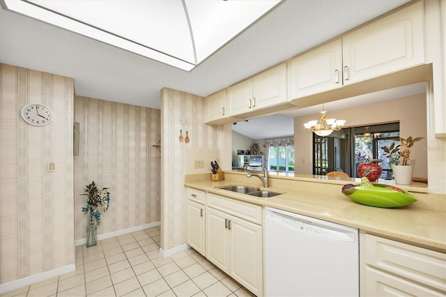 kitchen with a sink, light countertops, dishwasher, and light tile patterned flooring