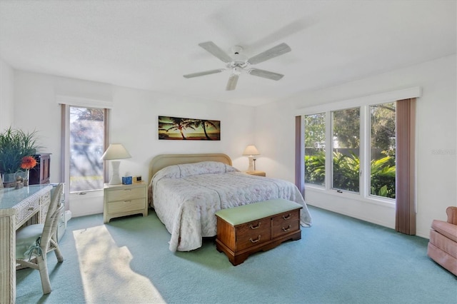 carpeted bedroom featuring ceiling fan