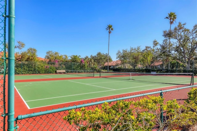 view of tennis court with fence