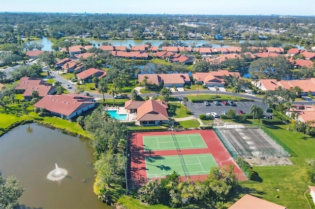 drone / aerial view featuring a residential view and a water view