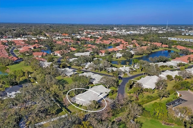 aerial view with a water view and a residential view