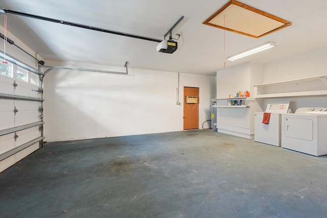 parking garage with a garage door opener and separate washer and dryer