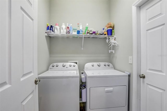 washroom with laundry area and washer and dryer