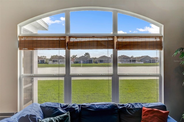 interior space featuring a water view and a residential view