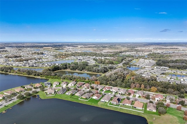 bird's eye view featuring a water view and a residential view