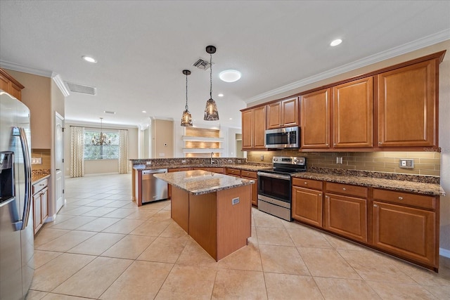 kitchen featuring a peninsula, brown cabinets, stainless steel appliances, and ornamental molding