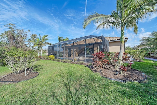 view of yard with glass enclosure