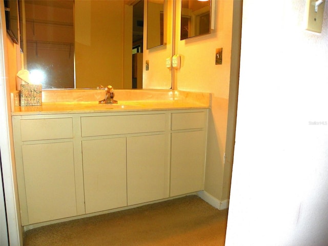 bathroom featuring vanity and baseboards