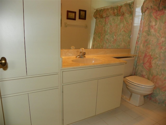 full bathroom with a shower with curtain, vanity, toilet, and tile patterned floors