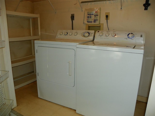 washroom with laundry area, independent washer and dryer, and light floors