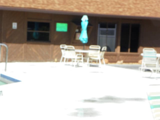 view of patio / terrace with outdoor dining area and a sink