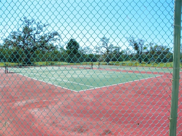 view of sport court with fence