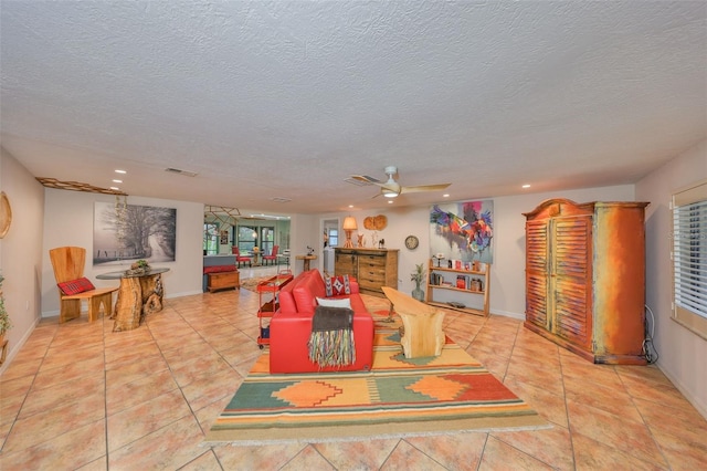 interior space featuring a textured ceiling, tile patterned flooring, visible vents, and recessed lighting