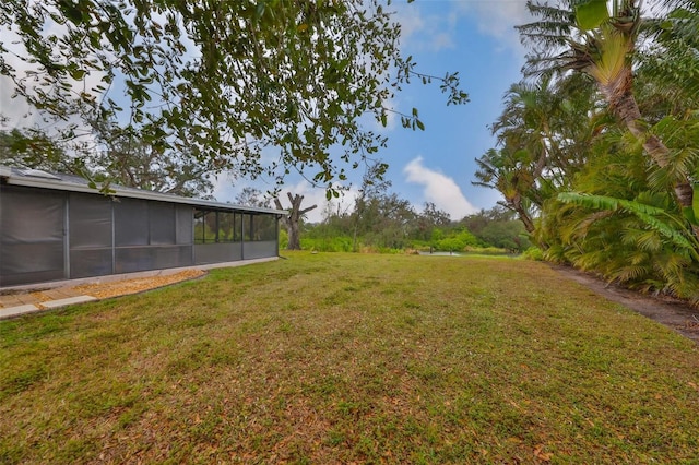 view of yard with a sunroom