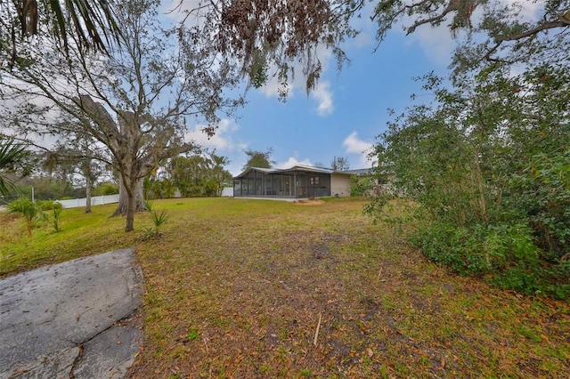 view of yard featuring a sunroom