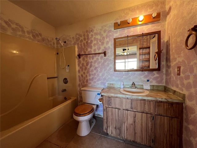 full bathroom featuring shower / washtub combination, wallpapered walls, toilet, vanity, and tile patterned floors